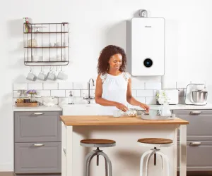 woman in modern kitchen with boiler