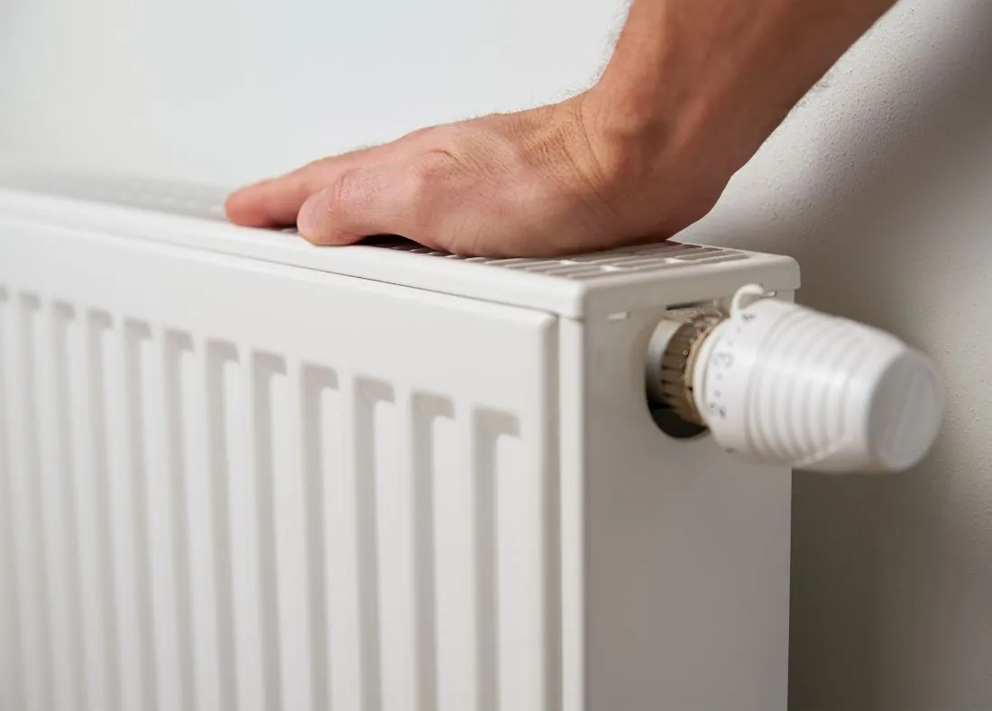 Hand on top of radiator